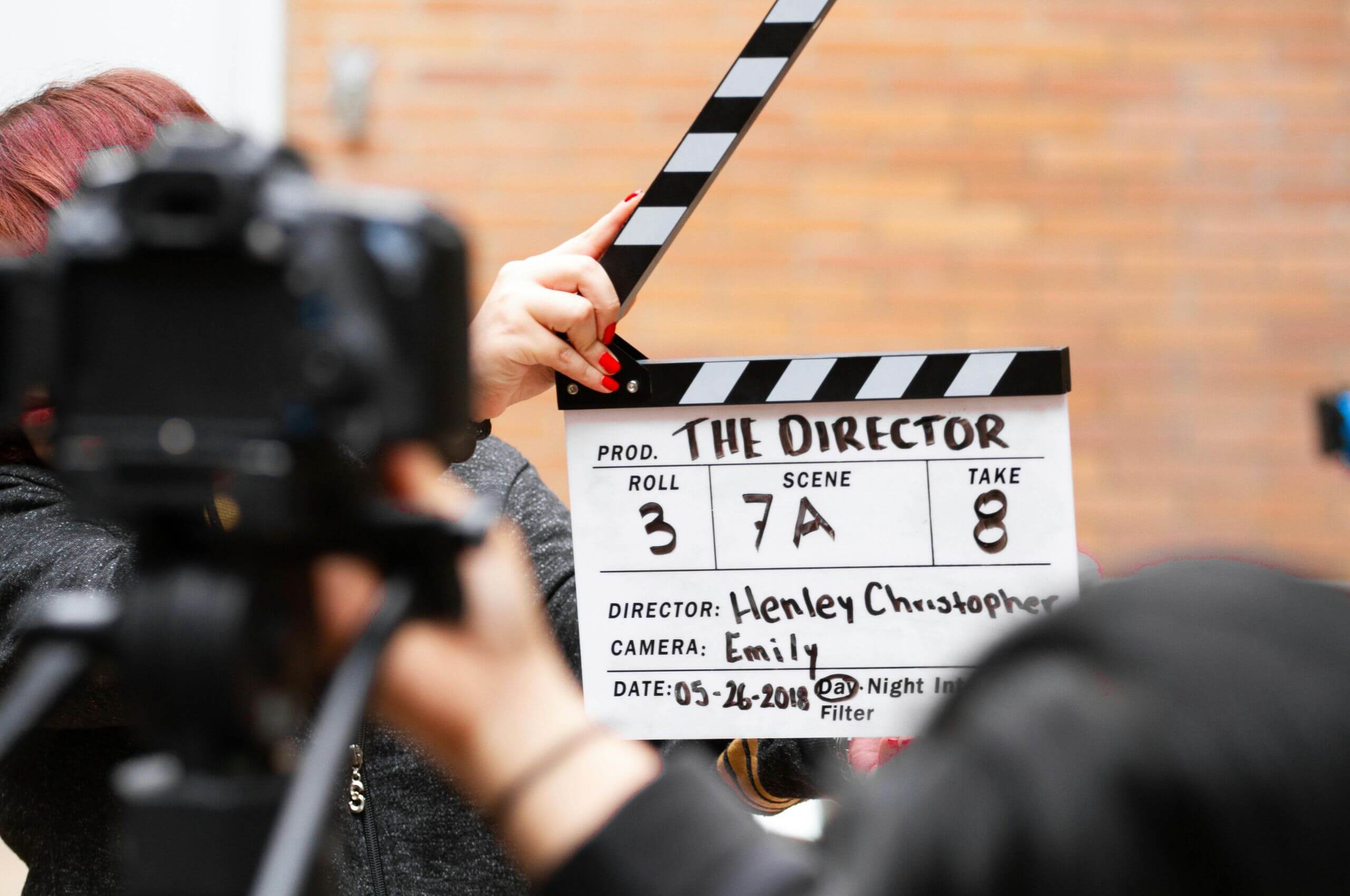 Female holding Clapper Board for Video shoot